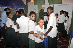 Children learn how GIS is used in agriculture during a GIS Day program in Belize.